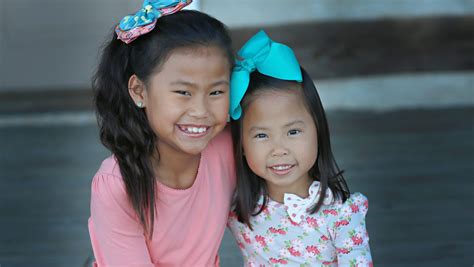 Missouri neighbors discover adopted daughters from China are half-sisters