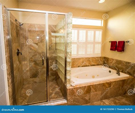 Modern Bathroom with Jacuzzi Tub and Bottle Glass Shower Stock Photo - Image of bath, indoors ...