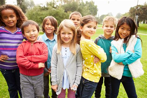 Group Of Young Children Hanging Out In Park - Health Powered Kids