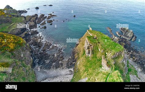 Findlater Castle Cullen Aberdeenshire coastline in Springtime and the ruins on a formidable ...