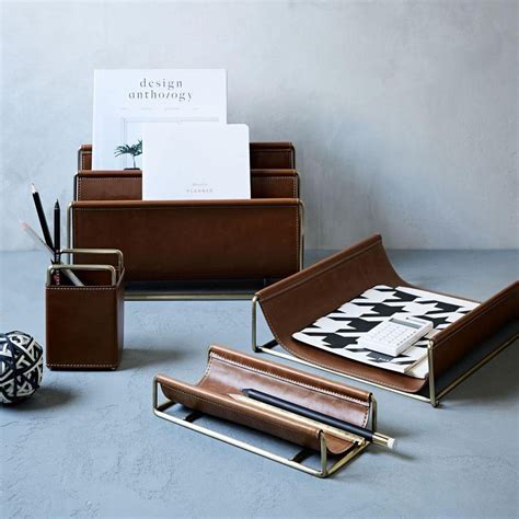 A sophisticated addition to any work station, our Faux Leather + Brass Office Accessories keep ...