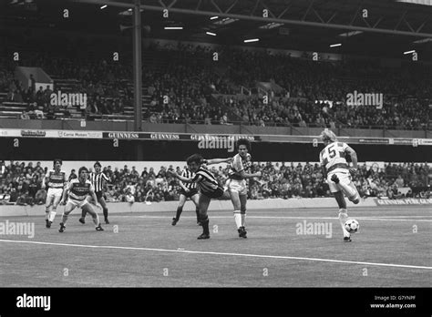 A header by Newcastle No 9 Billy Whitehurst (l) goes to the feet of ...