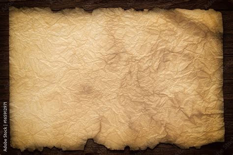 Old paper on the wood background, ancient scroll Stock Photo | Adobe Stock