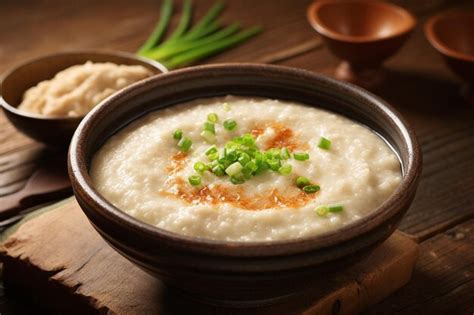 Premium Photo | Tofu jook congee with ginger and green onions