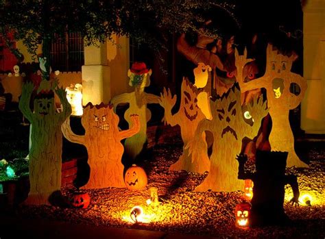 I like these trees...great idea for haunted forest decor. Halloween ...