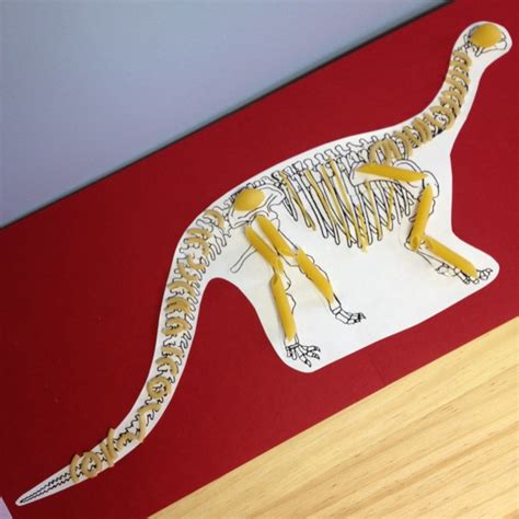 Dinosaur skeletons. Made with pasta. | Dinosaur skeleton, Dinosaur theme, Projects for kids