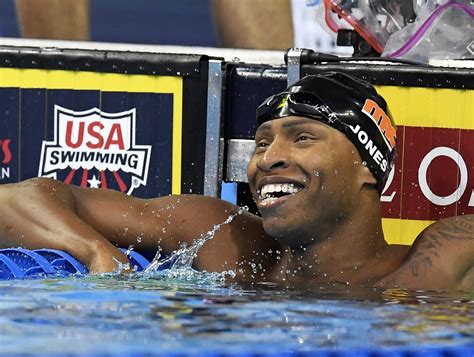 Column: White-dominated swimming struggles to diversify | AP News