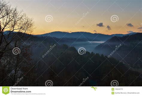 Misty Mountains Sunrise stock photo. Image of mountains - 105245772