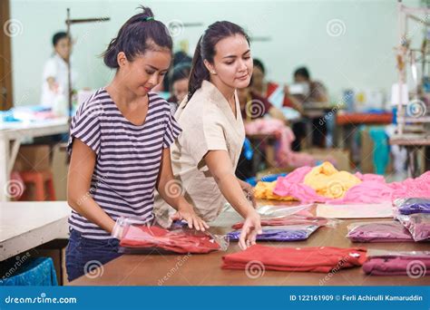 Workers at Textile Factory Packaging Their Products Stock Image - Image of people, factory ...