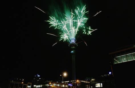 A fireworks display is launched from the Auckland Sky Tower during New Year's Eve celebrations ...