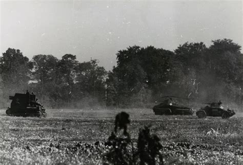 Sturmpanzer I on the move in France along with a Schwerer Panzerspähwagen Sd. Kfz. 231 (8-rad ...