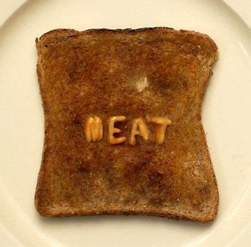 a piece of toast with the word eat spelled on it sitting on a white plate