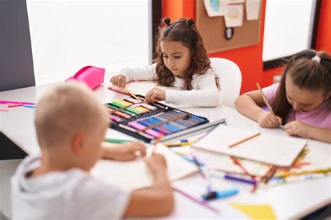 Group of Kids Preschool Students Sitting on Table Drawing on Paper at Classroom Stock Image ...