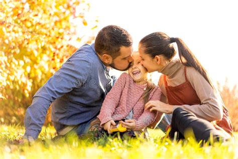 Family Walking in Autumn Park at Sunset Stock Photo - Image of park ...