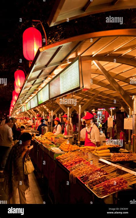 serving exotic food at the Wangfujing night market, Beijing,PRC Peoples Republic of China, Asia ...