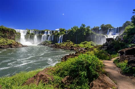 Located along the borders of Brazil, Argentina, and Paraguay, the Iguazu Falls drains into the ...