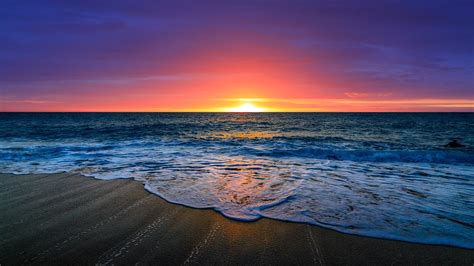 Nice Beautiful Ocean Waves Beach Sand In Purple Red Clouds Sky ...