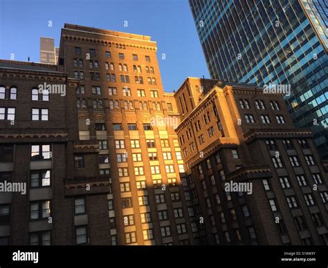 Sun shining on New York buildings Stock Photo - Alamy