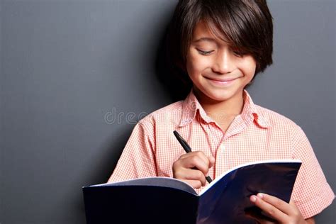 Cute Little Boy Writing on a Book Stock Image - Image of dark, concepts ...