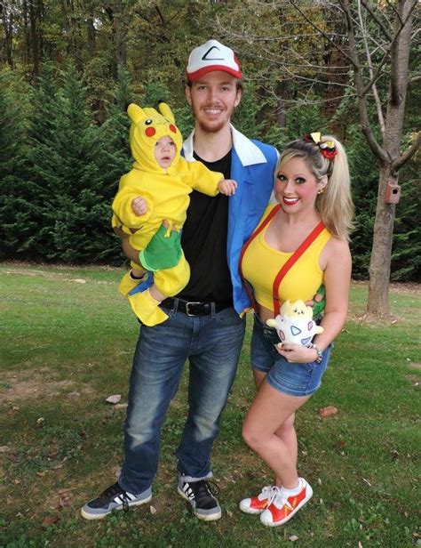 a man and woman in pokemon costumes posing for a photo with pikachu, pooh