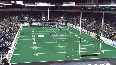 High resolution end zone camera view of a live indoor football game ...