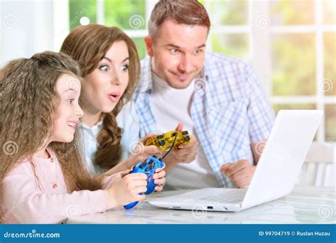 Family Playing Computer Game Stock Image - Image of reunion, integration: 99704719