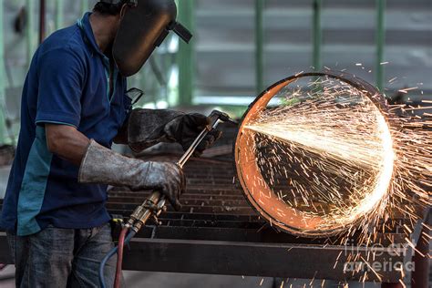 Metal cutting with acetylene torch Photograph by Sasin Tipchai - Pixels