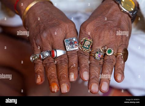 Mans hands wearing silver rings india hi-res stock photography and images - Alamy