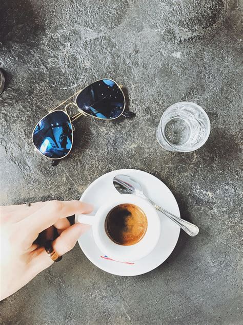 Person Holding Starbucks Cup With Brown Beverage · Free Stock Photo