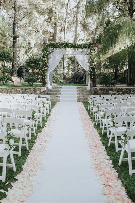 Love the set up for this outdoor wedding. flower petal lined wedding aisle. T… in 2020 | Garden ...