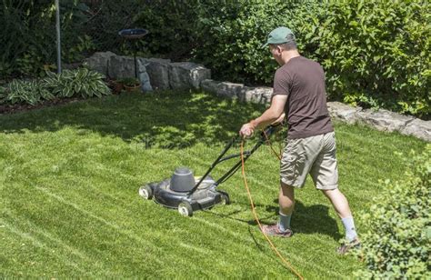 Grass Cutting With A Lawn Mower Stock Image - Image of shoes, link: 95481467