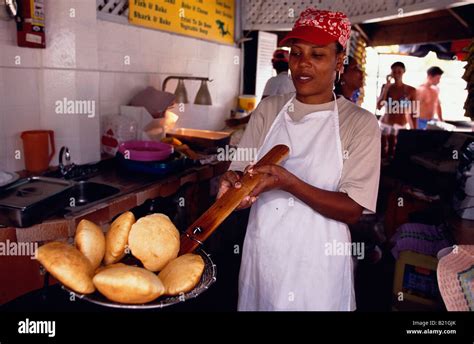 Woman baking Bake and Shark Trinidad Maracas Bay Stock Photo - Alamy