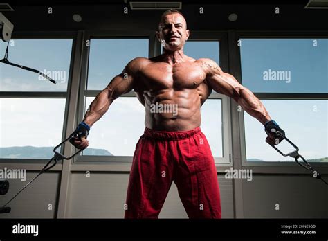 Chest Workout Cable Crossover In Gym Stock Photo - Alamy