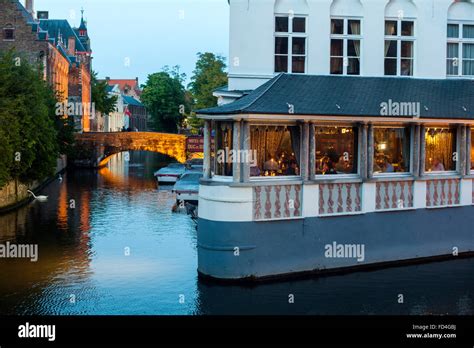 One of the many restaurants on the canal of the Belgian city of Bruges Stock Photo - Alamy