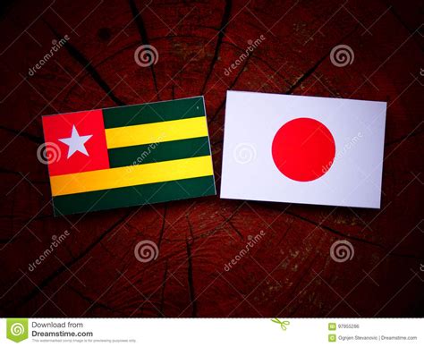 Togolese Flag with Japanese Flag on a Tree Stump Isolated Stock Photo ...