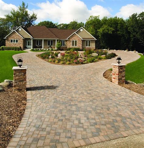 A circular Cobblestone driveway adds a degree of elegance to this home ...