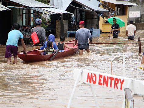 Philippines landslide death toll rises to 85 as rescue workers search for 20 missing people ...