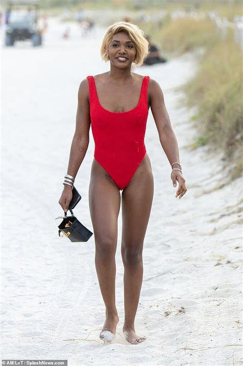 Magic Johnson's daughter Elisa pours her curves into red bathing suit | Red bathing suits, Magic ...