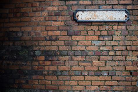 Brick Wall With Blank Sign Free Stock Photo - Public Domain Pictures