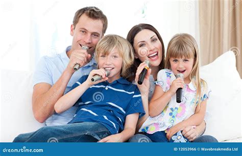 Happy Family Singing a Karaoke Together Stock Photo - Image of room, beauty: 12053966