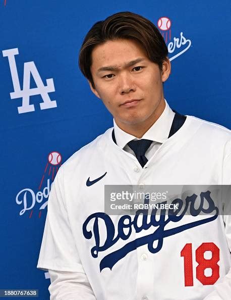 New Los Angeles Dodger, Japanese pitcher Yoshinobu Yamamoto, looks on ...