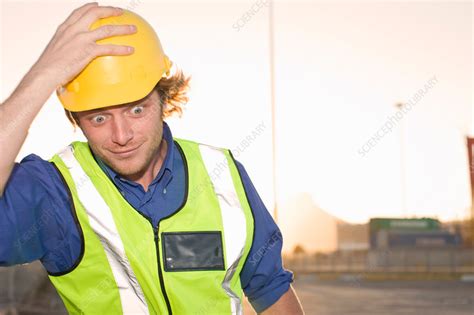 Construction worker wearing hard hat - Stock Image - F005/2626 - Science Photo Library