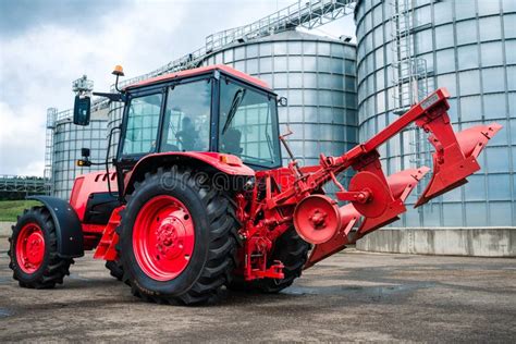 Farm Tractor with Plow on the Farm Stock Photo - Image of farming ...