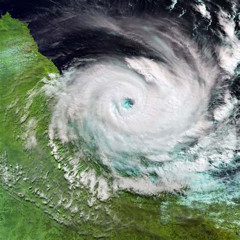 Satellite catches Cyclone Debbie striking Queensland - Cosmos Magazine