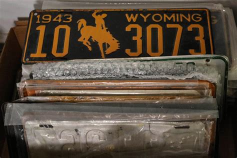 #142: A COLLECTION OF VINTAGE LICENSE PLATES