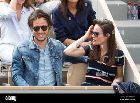 Vianney and his girlfriend Catherine Robert in stands during French ...