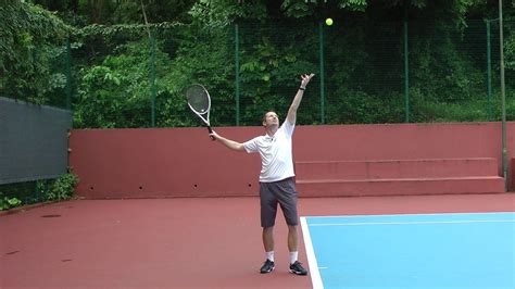 An accurate tennis serve toss that consistently reaches the right location and height can only ...