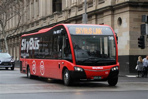 SkyBus Melbourne bus #35 BS04NK heads west on a hotel shuttle at Lonsdale and William Street ...