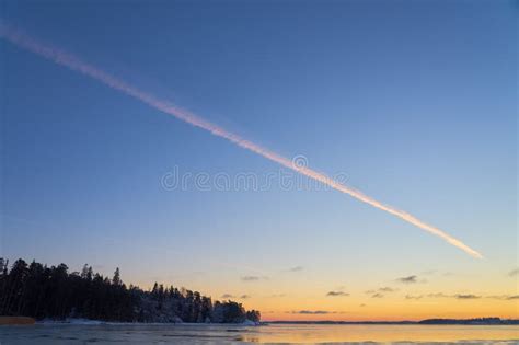 A Trail from the Plane in the Sunset Sky Stock Photo - Image of machine ...