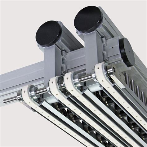 Overhead vacuum belt conveyors